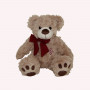 Peluche ours beige avec nœud rouge